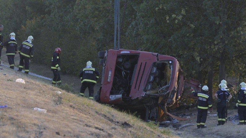 Footage distributed via Hromadske's Telegram channel shows a Polish-registered coach on its side in a Hungarian roadside ditch following the 16 August 2026 crash.