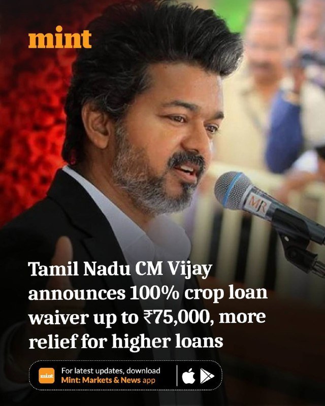 A man with a beard speaks into a microphone, overlaid with a news caption about a Tamil Nadu crop loan waiver announcement.