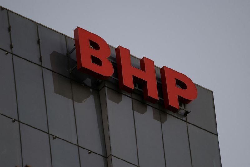 Trading screens show BHP Group Limited price action as labour negotiations with unions stall.