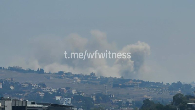Smoke rises over the southern Lebanese border during Israeli shelling reported on 21 August 2026.