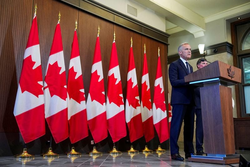 Canadian Prime Minister Mark Carney addressing reporters after Ottawa announced retaliatory tariffs against US imports.