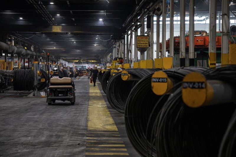 Steel coils await shipment at a Canadian port facility, August 2026.