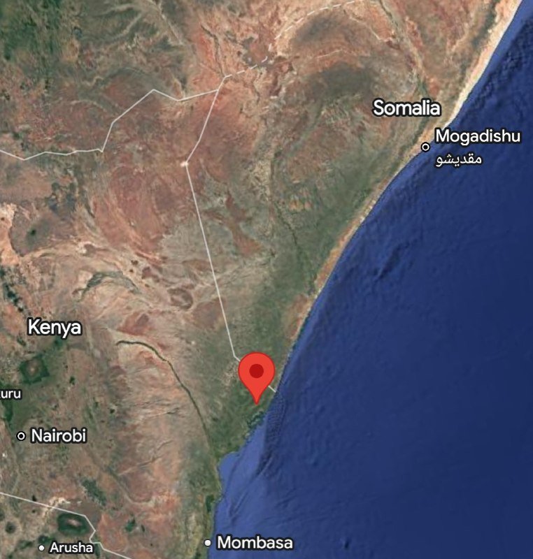 A satellite map displays a red location pin on the East African coast near the Kenya-Somalia border, with labels for Nairobi, Mombasa, Mogadishu, and Arusha.