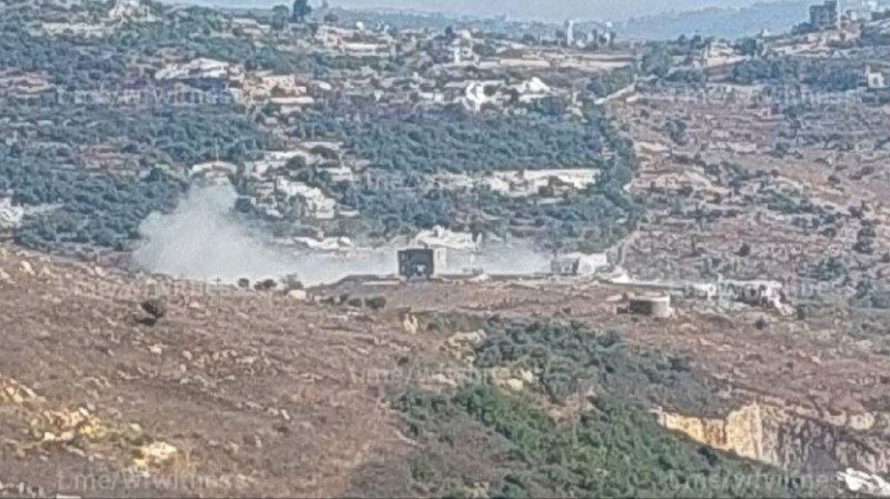 Smoke rising over a southern Lebanese village after strikes reported on 25 August 2026.