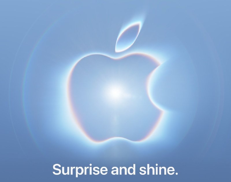 A glowing Apple logo with a rainbow-hued outline appears on a blue background above the text "Surprise and shine."