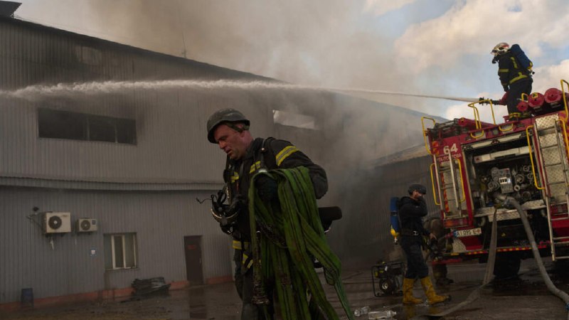 Fire and smoke rise from an industrial facility on the outskirts of Kyiv after a Russian drone strike on 29 August 2026.
