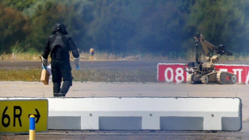 Relayed imagery from the joint Berlin press briefing on 1 September 2026 at which German ministers accused a Russian intelligence service of staging the Leipzig/Halle Airport drone attack.