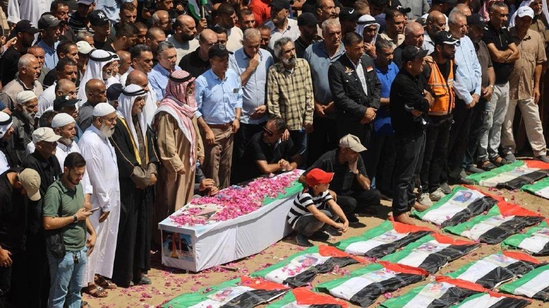 Mourners gathered in Gaza City for the mass funeral of Palestinians recovered from rubble in al-Zeitoun.